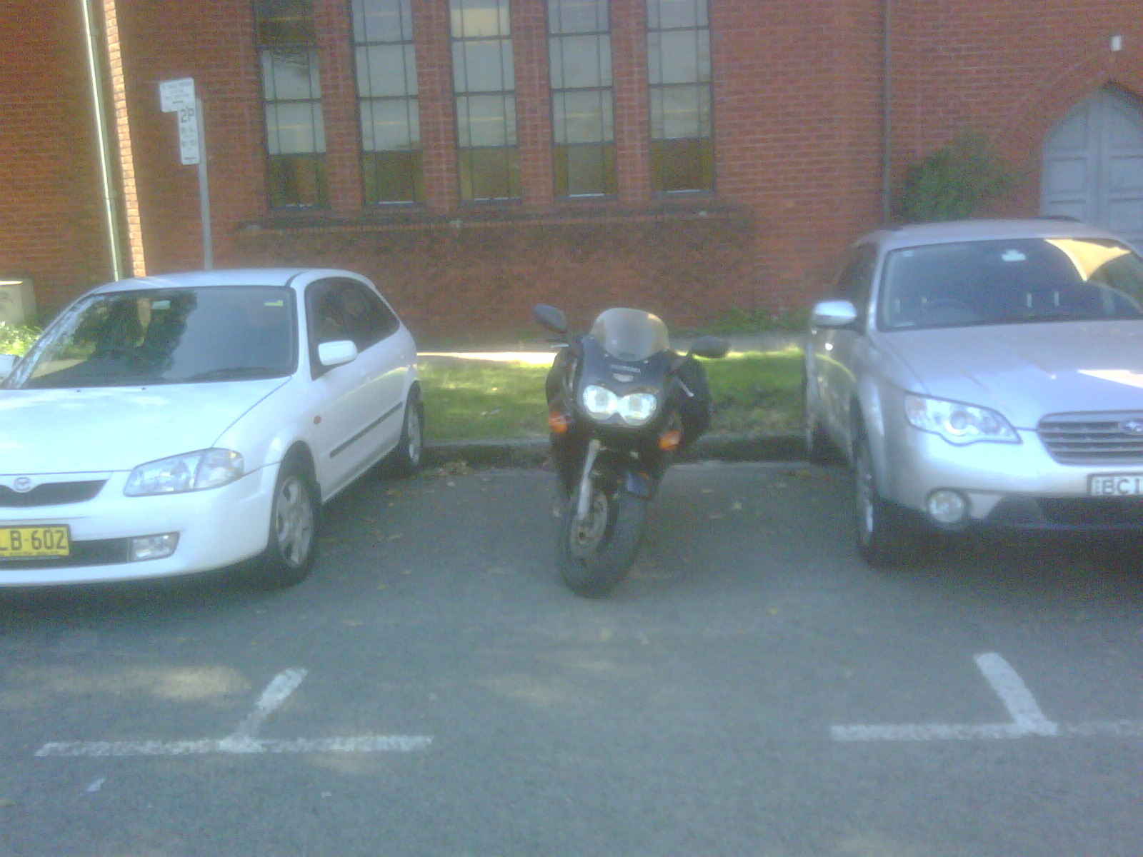 Motorcycle takes advantage of inconsiderate parking